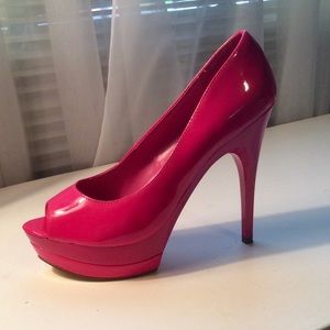 Pink peep toe platform pumps